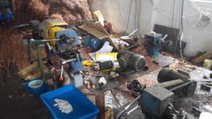 Photographs taken at an actual counterfeit consumable manufacturing facility that was shut down in 2014. The factory is unkempt and appears to be poorly maintained. There is a noticeable lack of quality and safety testing equipment.
