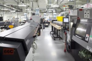 Actual photographs of the manufacturing facility of an OEM (Hypertherm). In comparison, the factory is well organized with clearly segmented work areas, and well-maintained equipment.